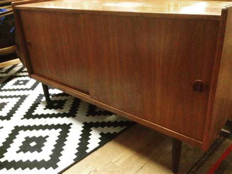 From Then On - Teak credenza with sliding doors on tapered legs. Top