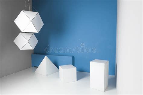 White Geometric Shapes in Room with Blue Wall Stock Image - Image of ...