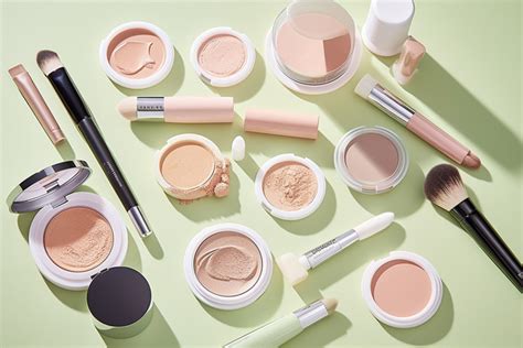 Various Cosmetics And Makeup Products Lay Out On A Table Background