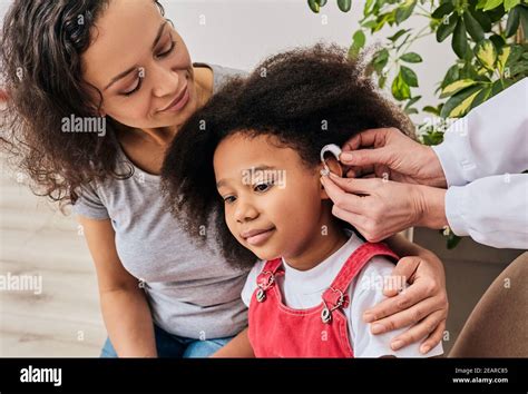 Deaf Child Hearing Aid Hi Res Stock Photography And Images Alamy