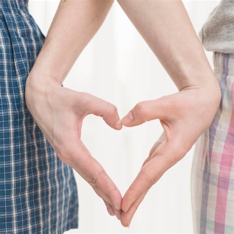 Free Photo Close Up Of Lesbian Couples Hand Making Heart Shape