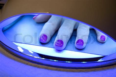 Closeup Of A Woman Hand Inside A Uv Stock Image Colourbox