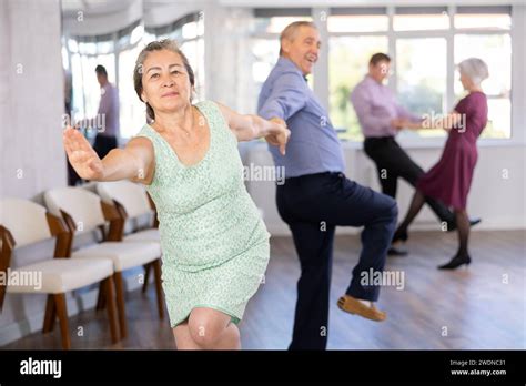 Beautiful Mature Woman In Dance Salon Studying With Her Partner To