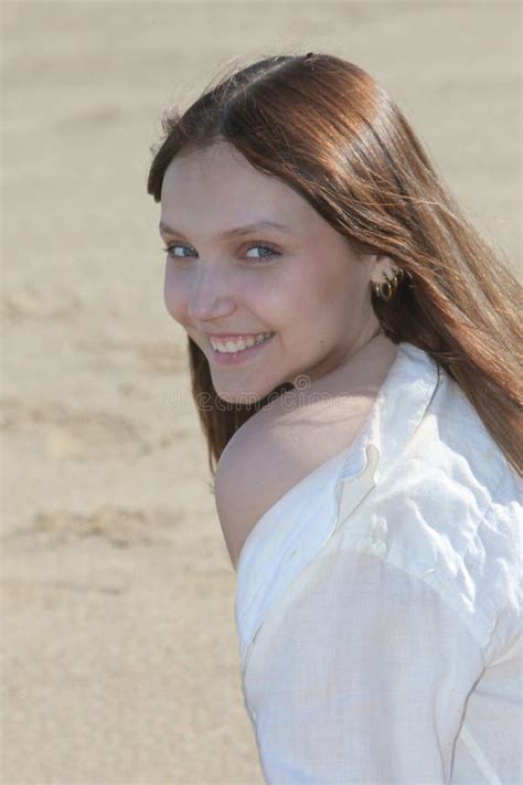 Beautiful Smiling Girl at the Beach Sitting on Sand Stock Photo - Image ...