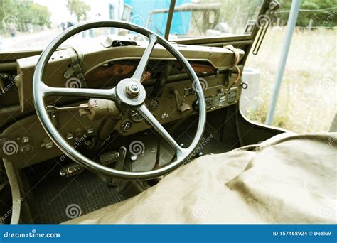 Interior Of Old Military Car With Steering Wheel And Dashboard Stock