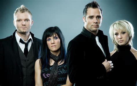 Members of skillet rock band in black