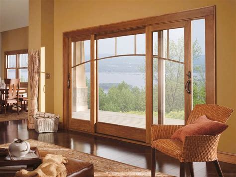 A Living Room Filled With Furniture Next To A Large Open Window Covered