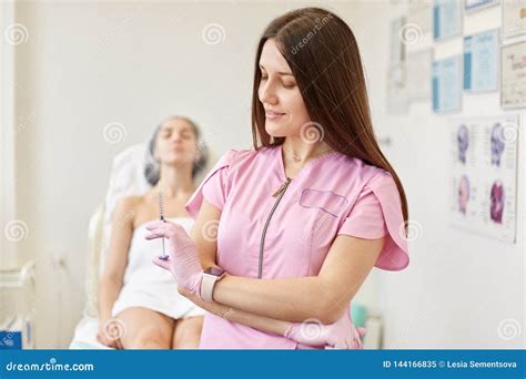 Young Dark Haired Attractive Doctor Dressed Pink Gown And Latex Gloves