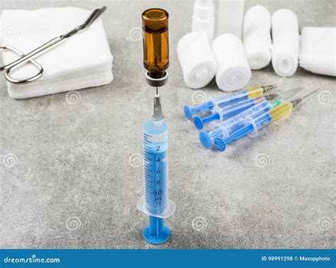 Nurse Filling Up An Injection For Patients With Other Medical Tools