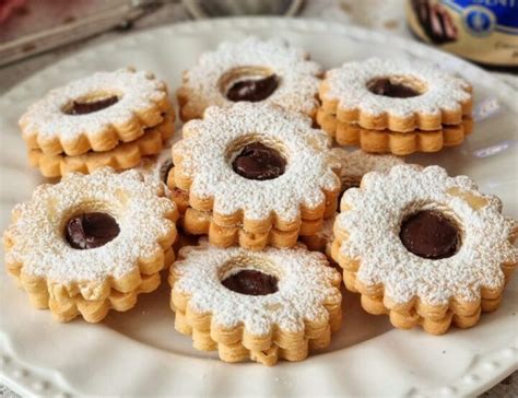 BISCOTTI FROLLINI AL BURRO CON CREMA AL CIOCCOLATO FONDENTE Dolce