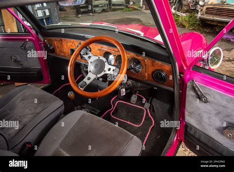 grey interior with wood steering wheel and trim on a classic Austin ...