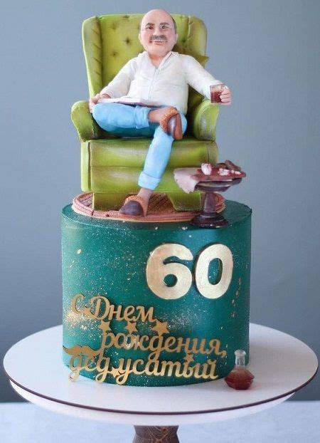 A Man Sitting In A Green Chair On Top Of A Cake