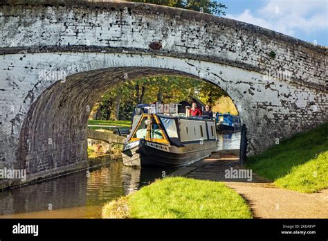 Canal Narrowboat Passing Under A Bridge On The Shropshire Union Canal