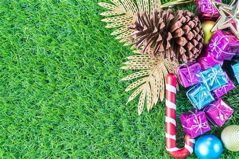 Premium Photo | Christmas decoration on green grass background