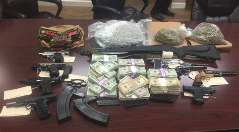 Authorities Cash Drugs Guns Seized In Bentonville Search