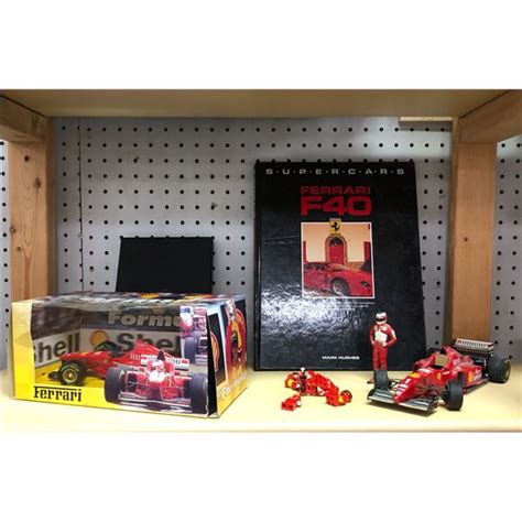 Group of 2 Ferrari F1 model cars, Ferrari driver, lego pit crew