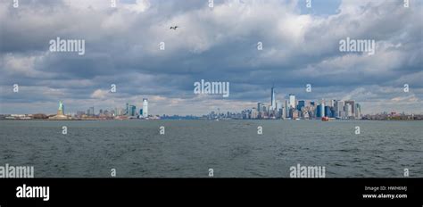 Panoramic view of Lower Manhattan Skyline and Libery Island and Liberty ...