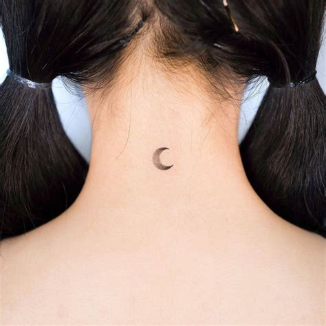 Minimalist Crescent Moon Tattoo On The Back Of The