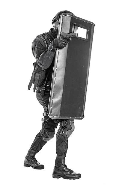 Premium Photo Swat Officer With Ballistic Shield