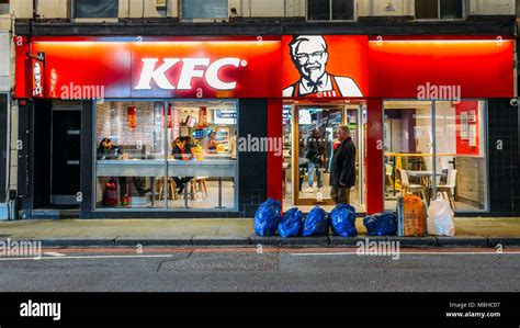 Exterior of a Kentucky Fried Chicken - KFC restaurant at night on Earl ...