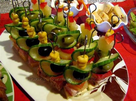 An Assortment Of Appetizers Are Arranged On A Platter With Toothpicks