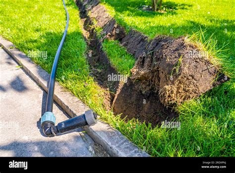 Installing A Pop Up Sprinkler In The Lawn Close Up Grass Irrigation