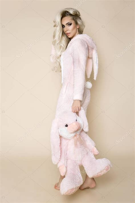 Beautiful Sexy Blonde Woman Wearing Pajama Bunny Costume Smiling