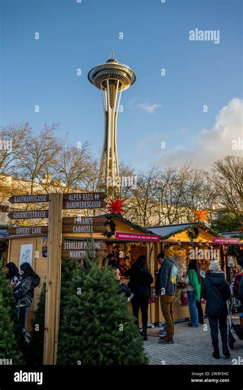 Seattle Christmas Market Scene With Vendors And The Space Needle At The