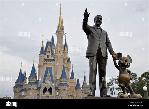 Walt Disney And Mickey Mouse Statue In Front Of Cinderella Castle