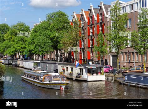 Tourist cruise boat on Prinsengracht canal in Amsterdam, Netherlands ...