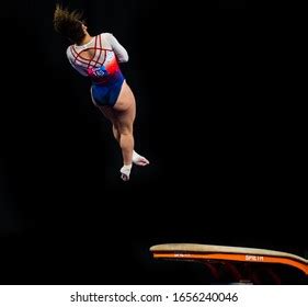 Female Gymnast Performing Somersault Gymnastics On Stock Photo ...