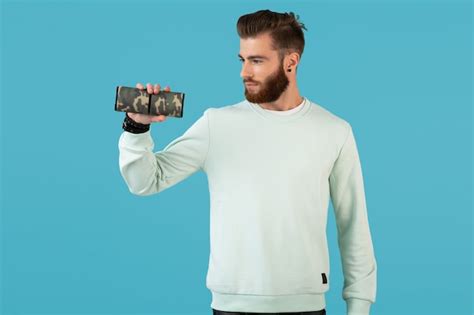 Premium Photo Stylish Smiling Young Man Holding Wireless Speaker