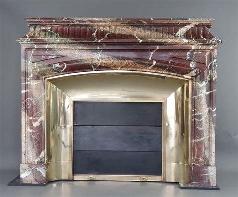 Important Louis Xiv Fireplace With Acroterion In Campan Grand Mélange Marble For Sale At 1stdibs