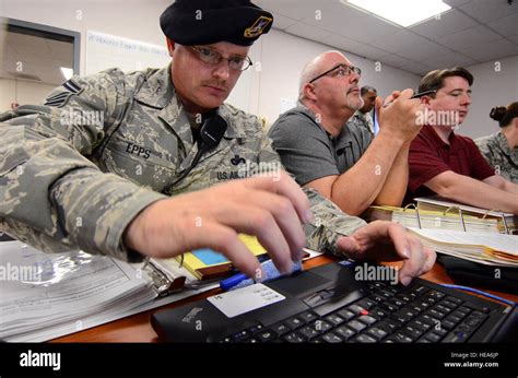 Senior Master Sgt Rocky Epps 94th Security Forces Squadron Inputs Information Into An