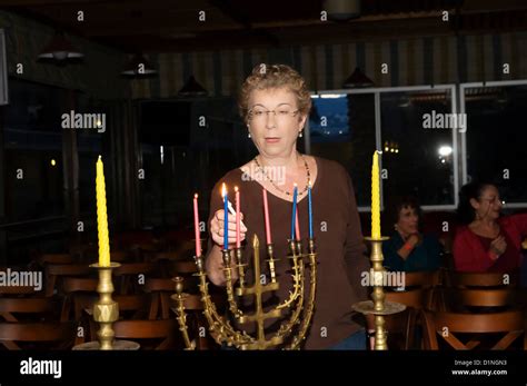 lighting the Chanukah Menorah Stock Photo - Alamy