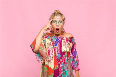 Premium Photo Middle Aged Blonde Woman Looking Surprised