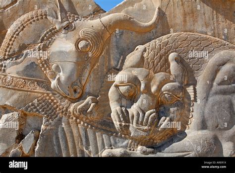 Bas Relief Carving Of A Lion Hunting A Bull At Perspolis Iran Stock