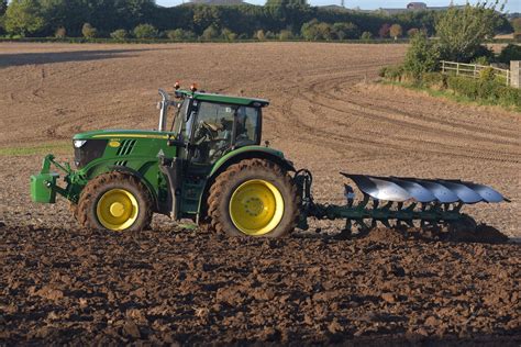 John Deere 6215R Tractor With A Kverneland 5 Furrow Plough Flickr