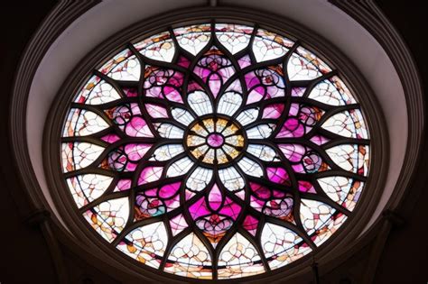 Premium Photo A Stained Glass Rose Window Observed From The Interior Of A Gothic Revival Edifice