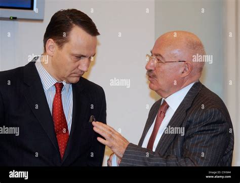 Polish Minister Of Foreign Affairs Radoslaw Sikorski Left And His