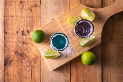 Premium Photo Tequila Shots With Salt And Lime On A Bar Table