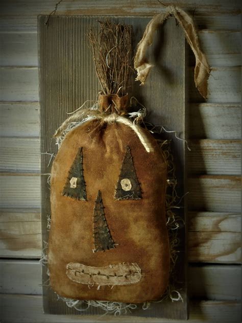 Primitive Grungy Pumpkin Jol On An Old Looking Board Hanger By Oldatticprimitives On Etsy