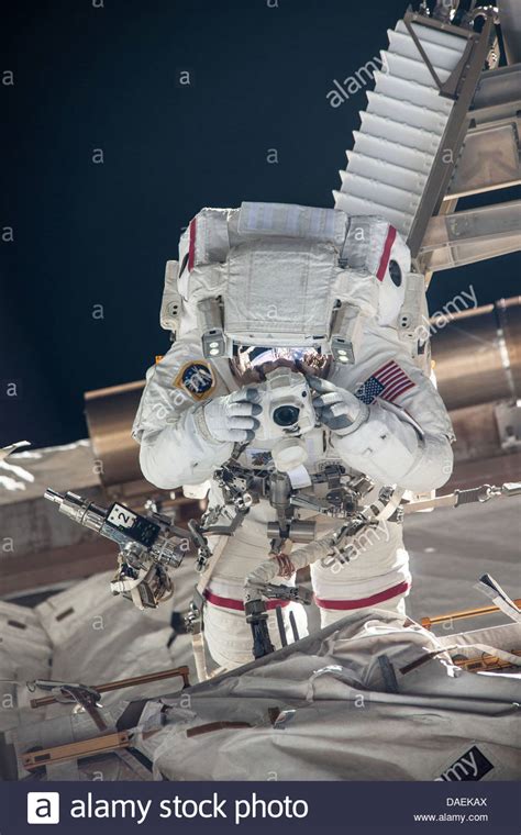 Nasa Astronaut Chris Cassidy Takes A Photograph During A Spacewalk As Work Continues On The