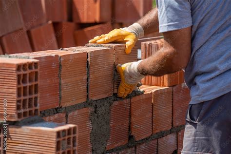 Masters who make concrete mortar and masonry in construction Stock Photo | Adobe Stock