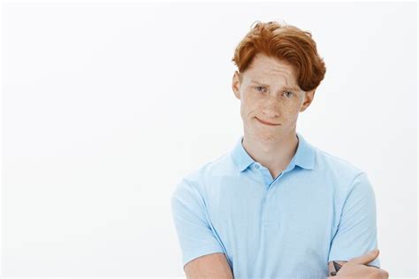 Free Photo Close Up Of Perplexed Indecisive Redhead Man Smirking And