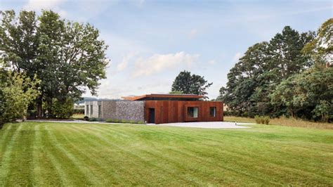 Hudson Architects Wraps Coast House In Flint And Corten Walls