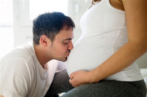 Happy Pregnant Woman Relaxing With Her Husband Stock Photo By Nd3000