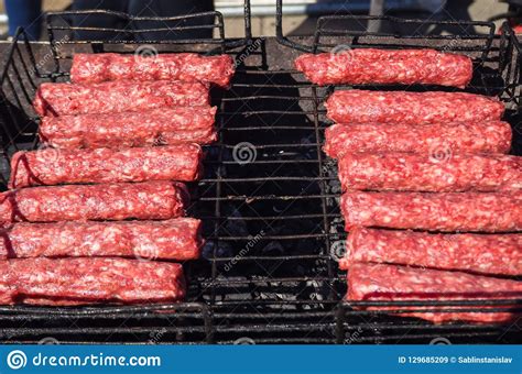 Moldovan Mititei and Cooked on the Grill in the Smoke. Stock Image ...