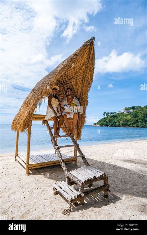 Couple On The Beach In Phuket Relaxing On A Beach Chair Tropical Beach