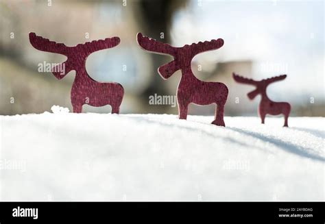 Wooden Christmas deer on snow Stock Photo - Alamy